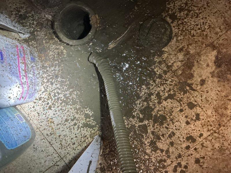 Responded to a clogged basement laundry room drain requiring mechanical snaking. Upon arrival, found standing water on the floor indicating a complete blockage in the drainage system. Successfully cleared the obstruction using a drain snake through the floor drain, restoring proper water flow and drainage function. Verified the utility sink plumbing connections and main drain stack were functioning correctly with no additional clogs or backup issues detected.