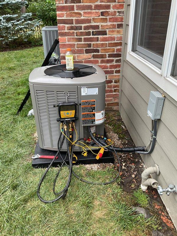 Successfully completed installation of a 2-ton air conditioning system with matching evaporator coil at rear of residence. Installed new outdoor condensing unit on pad, ran refrigerant lines, completed all electrical connections including disconnect box, and reconnected system components per manufacturer specifications. Performed system startup, charged unit with refrigerant to proper levels using manifold gauges, verified all electrical connections and proper voltage, and tested system operation to ensure optimal performance. Installed and programmed new Honeywell digital thermostat for accurate temperature control. All work completed in accordance with mechanical and electrical permit requirements, with system operating within normal parameters upon final inspection.