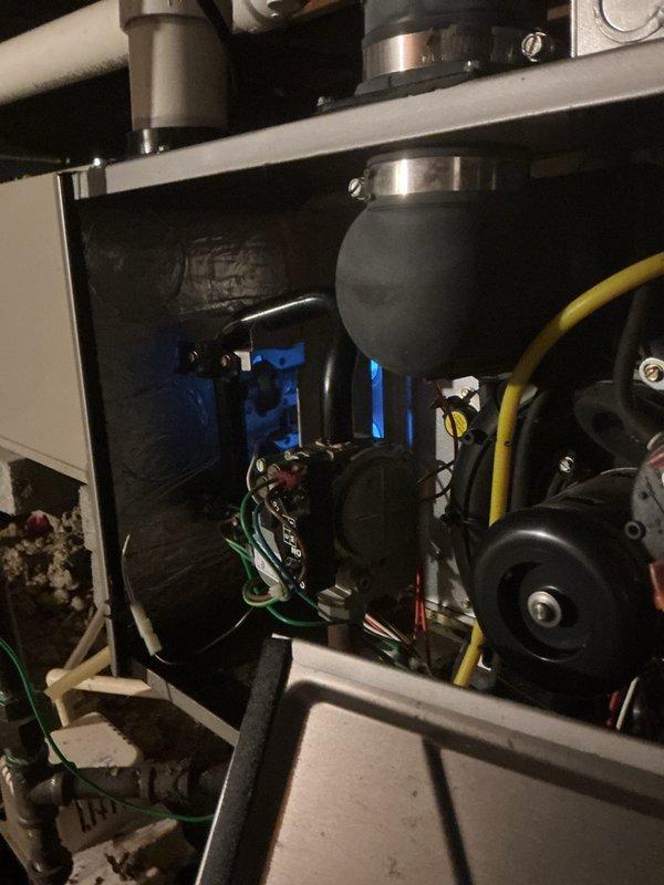 Completed comprehensive tune-up inspection on 15-year-old furnace system located in crawlspace. Performed thorough evaluation of all mechanical and electrical components including burner assembly, heat exchanger, blower motor, gas valve, and control board. Inspected thermostat operation, humidifier functionality, and hot water tank condition as part of standard maintenance protocol.

Identified failed inducer motor assembly requiring replacement. Ordered inducer motor assembly through Carrier Great Lakes with pickup scheduled at Livonia location. Unit tagged and customer advised of pending part arrival and installation. Documented all findings with photographic evidence showing internal component condition, wiring connections, and motor assembly. System operational status communicated to customer with callback number confirmed for scheduling return visit upon part receipt.