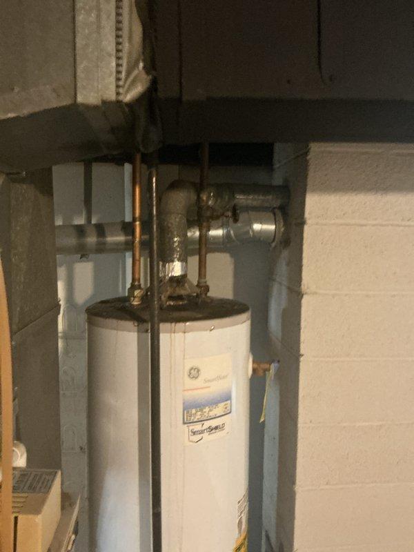 Conducted comprehensive on-site evaluation for complete HVAC system replacement including furnace and air conditioning unit, as well as hot water tank replacement. Assessed existing GE water heater with copper piping connections and documented current equipment conditions. Coordinated with plumbing department regarding additional scope items including leaky shower faucet, valve shutoff issues, and aging plumbing pipe replacement to ensure comprehensive estimate coverage for all identified system needs.