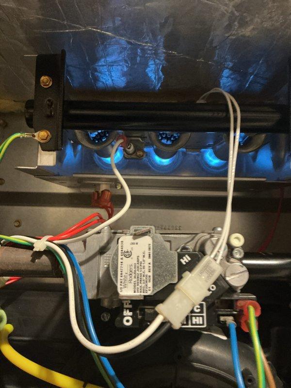 Completed comprehensive furnace inspection and tune-up on a 9-year-old natural gas heating system located in basement. Verified proper burner ignition and flame characteristics, confirmed blue flame pattern indicating optimal combustion, inspected gas valve operation and electrical connections, and documented all manufacturer specifications including 40,000 BTU/hr input rating. All components found operating within normal parameters with no immediate safety concerns or repairs required.