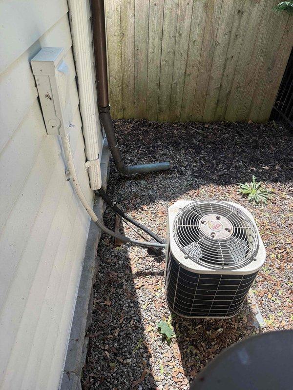 Completed comprehensive tune-up and inspection on two forced air systems located in garage and second floor attic. Attic unit identified as Bryant air handler with associated ductwork and proper insulation in place. Performed standard maintenance procedures including filter inspection, blower assembly evaluation, and electrical connection verification on both units. Inspected outdoor condensing unit situated in side yard, confirmed proper clearances, checked refrigerant lines and electrical conduit connections. Both systems operational and ready for heating season.