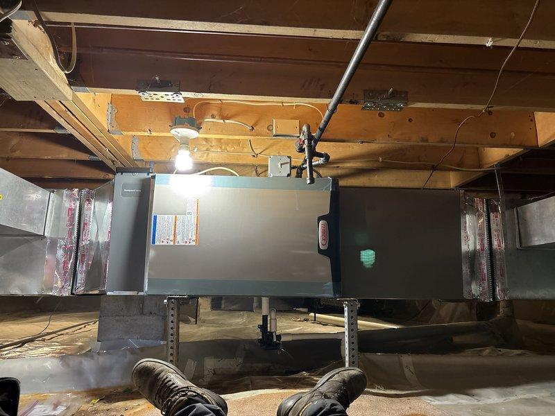 Completed full HVAC system installation including a 90,000 BTU furnace and 3-ton air conditioning unit with rear discharge configuration. Installed Lennox air handler in crawl space with proper mounting brackets and connected metallic ductwork with reflective insulation. Routed PVC condensate drainage, reconnected electrical components, and verified all mechanical and electrical connections per code requirements. Mechanical and electrical permits requested for inspection compliance, and system qualified for utility rebate program upon remeasurement verification.