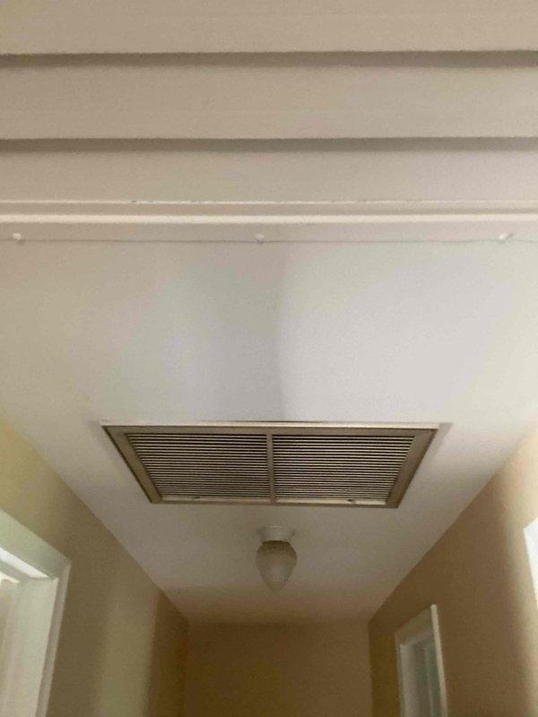 Responded to service call for 15-year-old residential air conditioning system located in attic that was blowing hot air. Upon inspection, diagnosed complete refrigerant loss in R-410A system, indicating system was flat with no remaining charge. Provided comprehensive estimate for full HVAC system replacement due to age of equipment and extent of refrigerant loss.