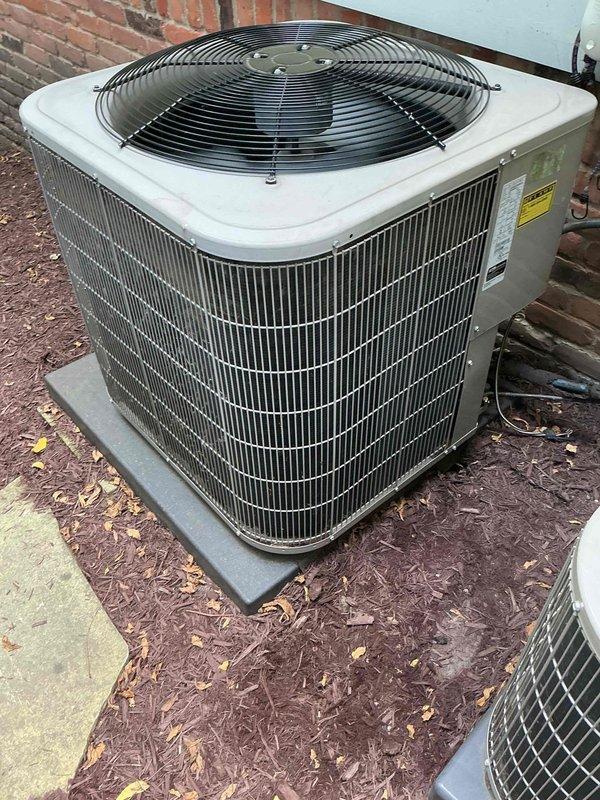Responded to no cooling complaint on 14-year-old residential air conditioning system. Found outdoor condensing unit not operating due to failed dual-run capacitor showing severe corrosion and rust on housing and terminals. Replaced defective 45+5 μF capacitor with new OEM equivalent, restored power to compressor and condenser fan motor, and verified proper system operation with normal cooling performance.