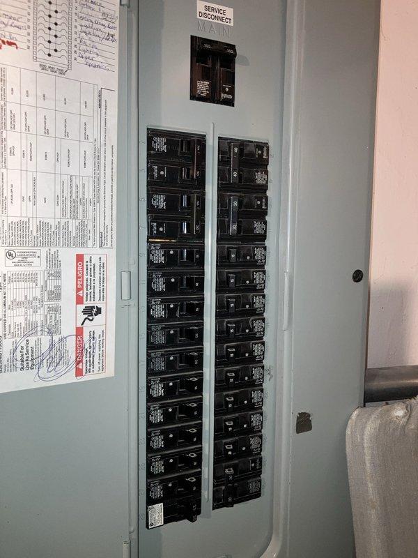 Completed fall furnace maintenance tune-up on a 25-year-old furnace unit located in the basement. Documented electrical panel configuration and circuit breaker layout, photographing the service disconnect, main breaker, and circuit directory for reference during equipment assessment. No issues were reported by the customer, and the system was evaluated for potential replacement recommendations given the age of the existing equipment.
