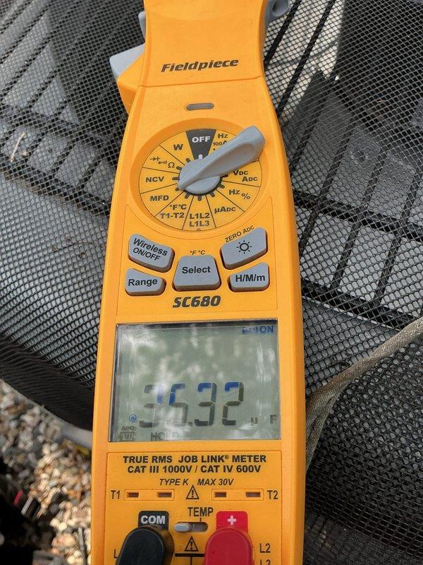 Responded to no cooling complaint on 7-year-old residential air conditioning system with non-operational outdoor compressor unit. Upon arrival, performed electrical diagnostics using clamp meter to verify voltage and amperage readings at the condenser unit located on gravel pad adjacent to residence. Customer had previously checked voltage and confirmed indoor furnace blower operation was functioning normally. Conducted comprehensive system evaluation including visual inspection of outdoor unit, electrical connections, and component functionality to determine root cause of compressor failure and restore cooling operation to the system.