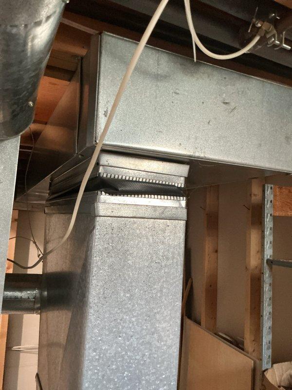 Completed estimate for replacement of two aging furnaces in basement of residential property under 1500 square feet. Both units are 33 and 34 years old and have reached end of service life. Inspected existing HVAC infrastructure including ductwork, condensate drainage systems, and mechanical room configuration. Documented current equipment specifications, duct connections, and installation parameters. Photographed existing furnace installations, sheet metal ductwork, flexible duct connections, PVC condensate lines, and drain pan assemblies to support replacement recommendations. Assessed mechanical room layout and clearances for new equipment installation. Provided comprehensive replacement options for dual furnace system upgrade.
