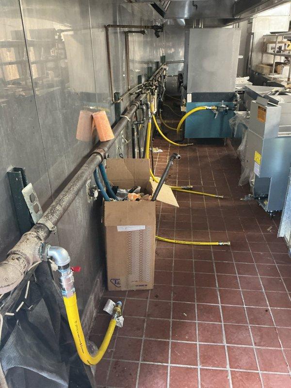 Conducted comprehensive site assessment of commercial mechanical room to provide gas line installation estimate. Evaluated existing utility infrastructure, pipe routing requirements, and equipment placement including compressor and tank systems. Documented current conditions of mechanical space with exposed ceiling infrastructure, existing piping systems, and available routing pathways for proposed gas line installation. Assessment included measurement and analysis of optimal connection points and compliance considerations for commercial gas line specifications.