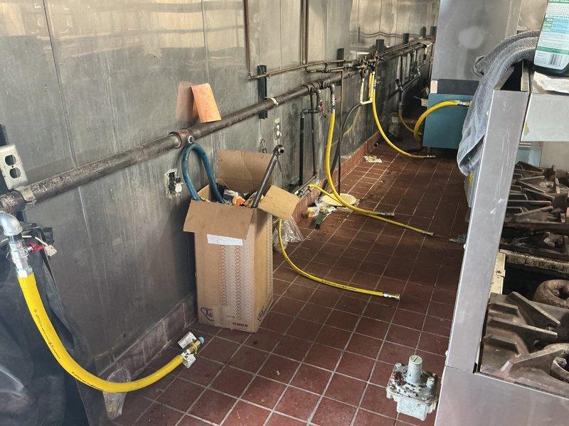 Conducted comprehensive site assessment of commercial mechanical room to provide gas line installation estimate. Evaluated existing utility infrastructure, pipe routing requirements, and equipment placement including compressor and tank systems. Documented current conditions of mechanical space with exposed ceiling infrastructure, existing piping systems, and available routing pathways for proposed gas line installation. Assessment included measurement and analysis of optimal connection points and compliance considerations for commercial gas line specifications.