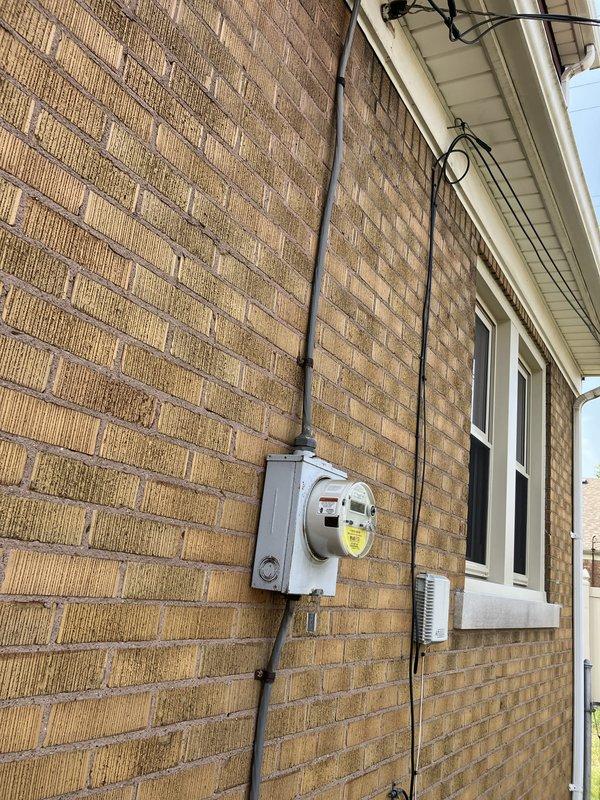 Responded to service call for water leaking from condensate pump during air conditioning operation. Upon inspection, found 26-year-old furnace with cracked heat exchanger and low R22 refrigerant levels in the existing system. Given the age of the equipment, multiple component failures, and the obsolete R22 refrigerant, provided estimate for complete HVAC system replacement including new furnace and air conditioning unit. Documented existing exterior equipment location and electrical service connections for replacement specifications.