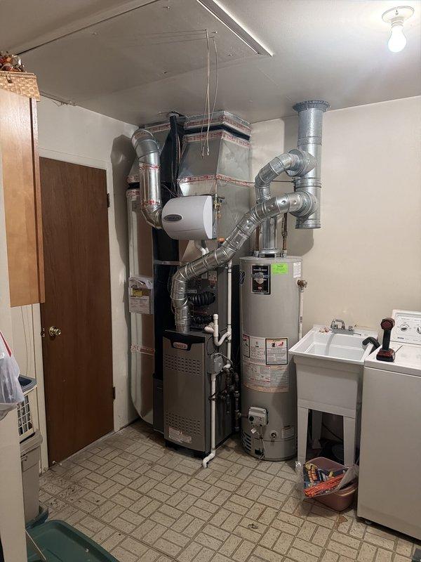 Completed full HVAC system installation including a 70,000 BTU furnace with integrated humidifier and 2-ton air conditioning unit with rear discharge configuration. Installed new ductwork, electrical disconnect box with proper circuit protection, and outdoor condensing unit with associated refrigerant lines and conduit. Reconnected all electrical components to code specifications, verified proper airflow throughout the system, and confirmed all equipment operational parameters within manufacturer specifications.