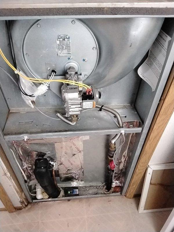 Completed 2023 violation repair work on residential HVAC furnace system. Addressed code compliance issues with the heating unit installation, including proper wiring configuration and component accessibility requirements. Verified blower motor assembly, gas valve connections, and electrical conduit routing meet current safety standards. Ensured adequate clearances around equipment for future maintenance access and proper ventilation. System tested and confirmed operational upon completion of all required corrections.