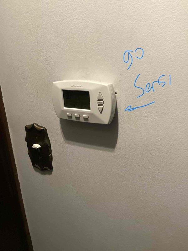 Conducted on-site evaluation for complete HVAC system replacement estimate. Assessed existing furnace in basement utility room and air conditioning unit located on exterior cement slab near back door. Documented current equipment condition, thermostat setup, and system configuration through comprehensive photography. Provided replacement options for both heating and cooling equipment due to age and system failure.