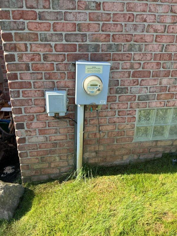 Conducted comprehensive assessment of 10-year-old residential air conditioning system experiencing compressor failure and producing hot air instead of cooling. Evaluated outdoor condenser unit located on concrete pad at building exterior and confirmed compressor malfunction requiring full system replacement. Presented replacement options and equipment specifications to homeowner for new AC installation to restore cooling functionality.