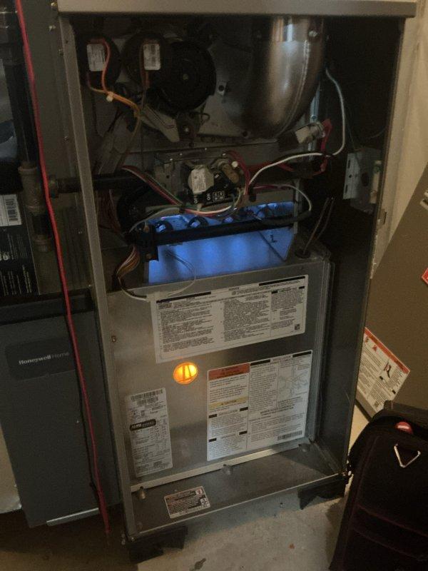 Completed comprehensive furnace and air conditioning inspection on 5-year-old residential HVAC system located in basement. Performed full system evaluation including blower motor operation, refrigerant line inspection, electrical connections, condensate drainage system, and internal components. Verified proper operation of humidifier and thermostat settings. Conducted hot water tank inspection as part of complete home comfort system assessment. All equipment found operating within normal parameters with no immediate service needs identified.