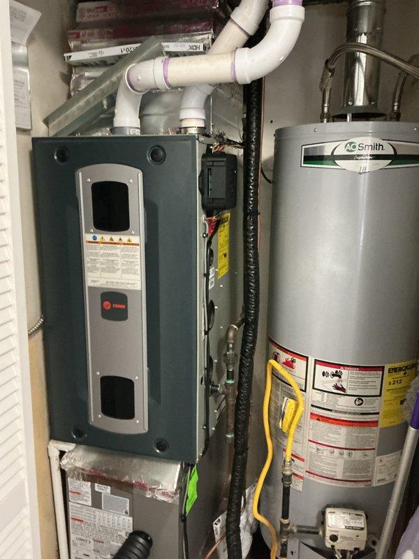 Responded to reported gas leak at furnace following recent AC installation and furnace relocation. Performed comprehensive gas leak detection and pressure testing on all gas lines serving the Trane furnace and A.O. Smith water heater. Inspected all gas line connections, fittings, and the gas valve assembly at the furnace location. Utilized leak detection solution and electronic gas detection equipment to test all joints, unions, and threaded connections throughout the system. Verified proper gas pressure at appliances and confirmed integrity of flexible gas connectors and black iron piping. All connections tested leak-free with no detectable gas escape at furnace supply line, water heater connections, or associated fittings. System deemed safe for continued operation with no corrective action required.