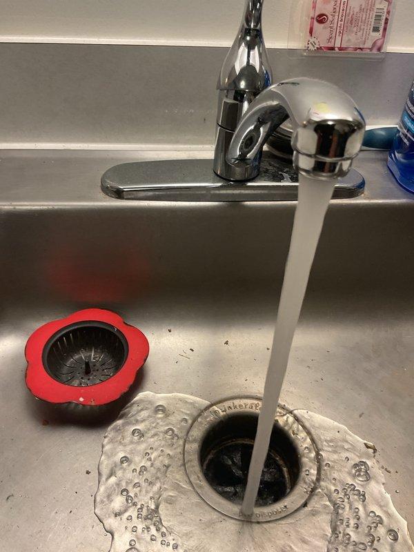 Responded to a service call for a garbage disposal that would not turn on. Upon inspection, diagnosed the unit and verified proper water flow through the kitchen sink drain system. Confirmed the garbage disposal unit, P-trap assembly, and drain connections were properly installed and secured beneath the sink. Tested the system to ensure proper operation and restored functionality to the disposal unit.