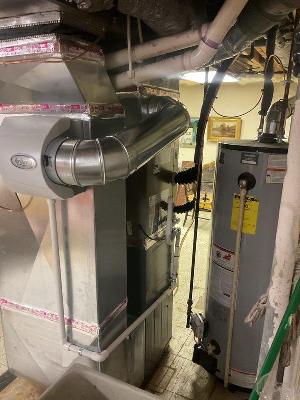 Completed installation of 2.5 ton air conditioning system with matching evaporator coil in right side yard location. Installed new outdoor condensing unit, connected refrigerant lines with proper insulation, and integrated new evaporator coil with existing air handler in interior utility space. Performed system reconnection, refrigerant charging, electrical connections, condensate drain routing with PVC piping, and full system startup and testing to verify proper operation and cooling performance.