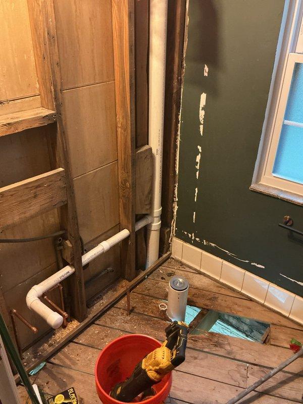 Responded to reported leaking pipe originating from basement area. Upon inspection, identified compromised plumbing assembly in exposed wall cavity consisting of copper supply lines and PVC drain system. Accessed affected area through interior wall framing to evaluate extent of water damage and source of leak. Performed necessary repairs to copper piping connections and verified proper sealing of all joints. Tested system for pressure integrity and confirmed leak resolution with no active water discharge present upon completion.