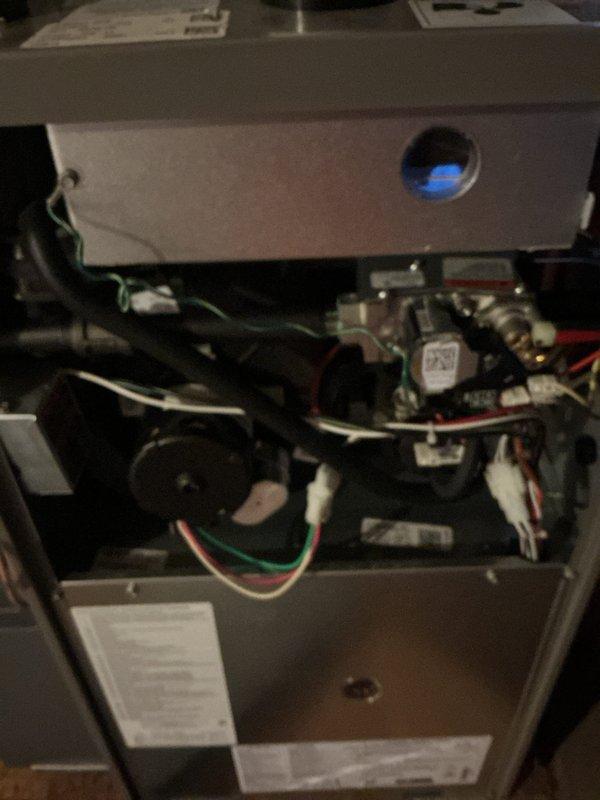 Completed comprehensive Gold AC Inspection on 2-year-old residential HVAC system including both furnace and air conditioning units. Inspected furnace located in basement, examining internal components, control board, wiring harnesses, flame sensor, and motor assemblies with all systems found operational. Performed exterior condenser unit evaluation in backyard, assessing fan assembly, housing condition, refrigerant line connections, electrical conduit, and overall unit performance with no deficiencies noted. Both units operating within normal parameters with no immediate service needs identified.