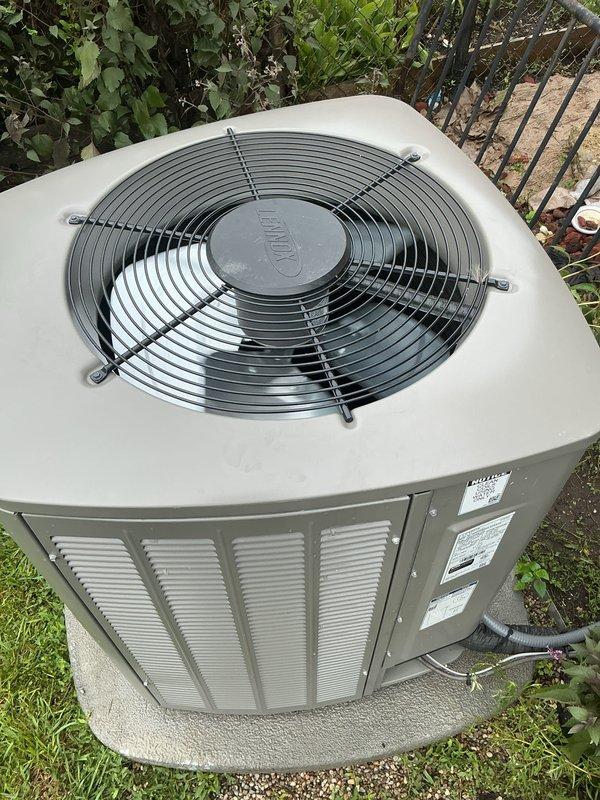 Completed comprehensive Gold AC Inspection on 2-year-old residential HVAC system including both furnace and air conditioning units. Inspected furnace located in basement, examining internal components, control board, wiring harnesses, flame sensor, and motor assemblies with all systems found operational. Performed exterior condenser unit evaluation in backyard, assessing fan assembly, housing condition, refrigerant line connections, electrical conduit, and overall unit performance with no deficiencies noted. Both units operating within normal parameters with no immediate service needs identified.
