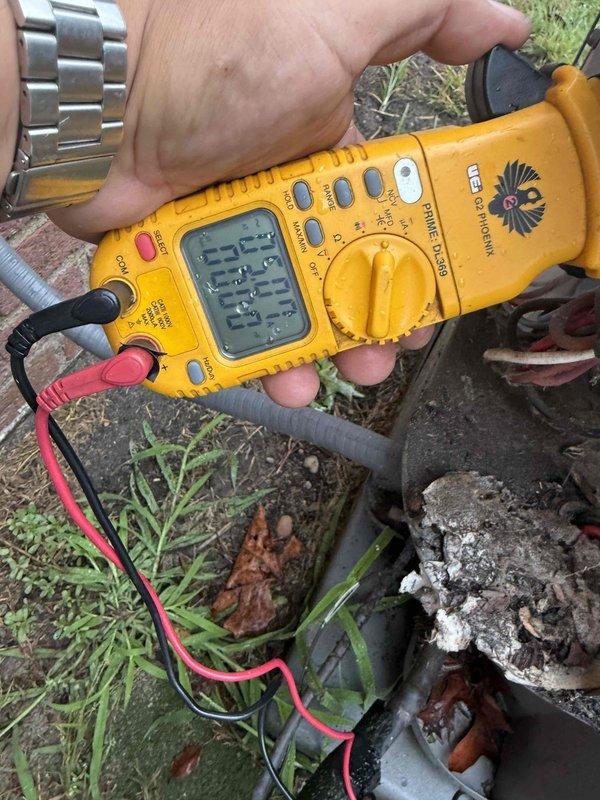 Responded to no cooling complaint on 22-year-old cooling system located in basement. Upon arrival, performed diagnostic testing on condenser unit and confirmed condenser fan motor failure. Used digital multimeter to test capacitor and verify electrical readings at the unit. Inspection revealed severely corroded refrigerant lines and compromised metal components with significant oxidation and rust buildup throughout the outdoor unit. Accessed control board and internal wiring to complete electrical diagnostics. Given the age of the equipment, extensive corrosion damage, and failed condenser fan motor, recommended full system replacement rather than repair. Discussed findings and replacement options with homeowner.