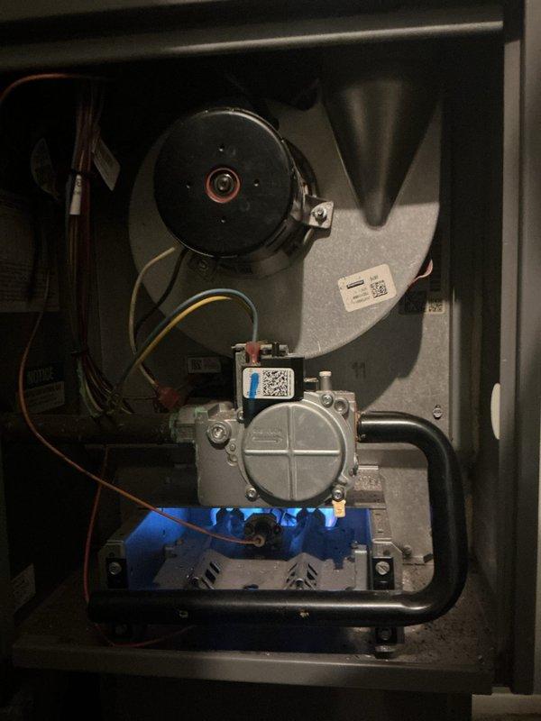Completed Gold Furnace Inspection on a 2018 Rheem forced air heating system located on the main level near the garage. Performed comprehensive visual inspection of all accessible components including blower motor assembly, gas valve, flame sensor, ignition system, electrical connections, and ductwork. Verified all wiring connections secure with no signs of damage or deterioration, inspected gas valve operation and connections, examined blower motor and housing for proper operation, and confirmed all safety controls functioning as designed. All components found in good working condition with no visible signs of rust, corrosion, or wear. Unit operating normally at time of inspection.