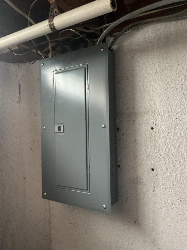 Completed comprehensive whole home electrical inspection of residential property. Evaluated exterior electrical service components including weathered meter box, disconnect junction box, and associated conduit connections, as well as interior main electrical panel mounted in basement utility area. All visible electrical infrastructure, wiring, and panel components were examined for code compliance, safety concerns, and proper installation standards.