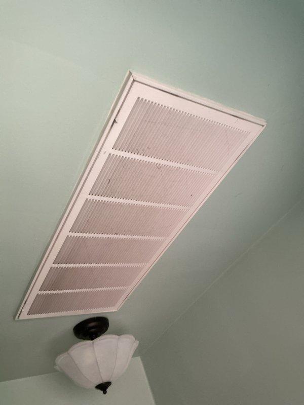 Conducted comprehensive assessment of non-functional UNICO high-velocity HVAC system installed in 2002 and located in attic space. Evaluated existing equipment configuration, ductwork layout including flexible aluminum ducting, and ceiling-mounted supply registers to provide replacement estimate for new system utilizing natural gas fuel source. Documented attic installation environment, structural conditions, and existing distribution components to develop accurate equipment replacement specifications.