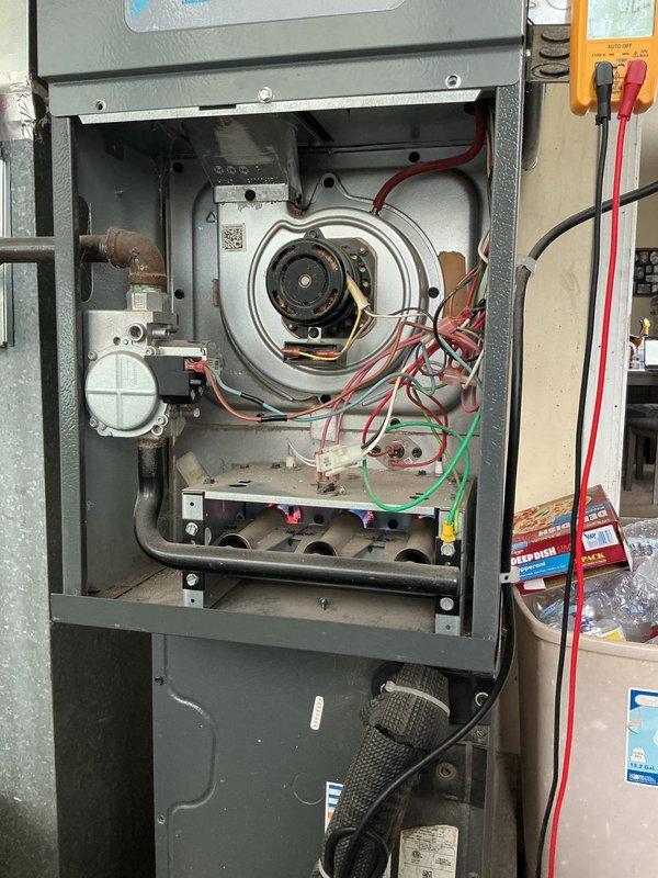Completed Gold AC and furnace inspection on a 6-year-old multi-unit HVAC system with equipment located in the backyard and laundry room. Performed comprehensive inspection of Daikin outdoor condenser unit, verifying proper operation of fan assembly, checking refrigerant pressures, and inspecting electrical connections with digital multimeter. Inspected indoor furnace unit with front panel removed, examining blower motor assembly, verifying all electrical connections and wiring integrity, checking condensate drainage system and copper line connections. All internal components showed no signs of deterioration, rust, or damage. Confirmed both units operating within normal parameters with proper airflow and no visible defects.