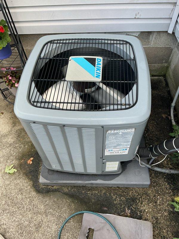 Completed Gold AC and furnace inspection on a 6-year-old multi-unit HVAC system with equipment located in the backyard and laundry room. Performed comprehensive inspection of Daikin outdoor condenser unit, verifying proper operation of fan assembly, checking refrigerant pressures, and inspecting electrical connections with digital multimeter. Inspected indoor furnace unit with front panel removed, examining blower motor assembly, verifying all electrical connections and wiring integrity, checking condensate drainage system and copper line connections. All internal components showed no signs of deterioration, rust, or damage. Confirmed both units operating within normal parameters with proper airflow and no visible defects.