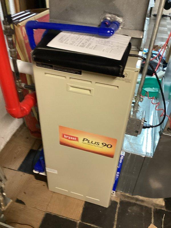 Conducted assessment of existing Bryant Plus 90 furnace system located in basement mechanical room for equipment replacement estimate. Documented current installation configuration including natural gas connections, PEX plumbing integration, electrical wiring, ductwork connections, and condensate management system to determine specifications for replacement unit proposal.