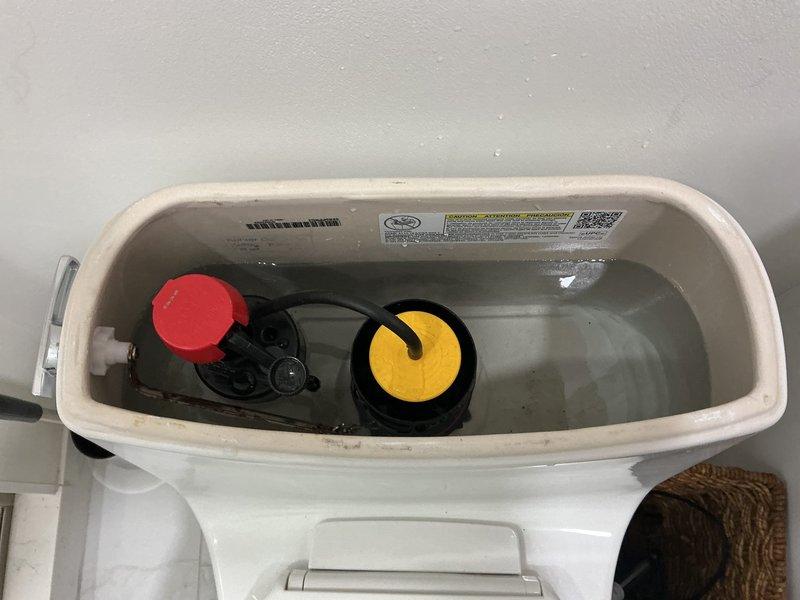 Responded to first-level toilet with continuous running water issue. Upon inspection, removed tank lid and assessed internal flush mechanism components. Identified worn flapper valve failing to create proper seal, allowing water to continuously flow from tank to bowl. Fill valve assembly with float mechanism showed signs of age and mineral buildup contributing to improper water shutoff. Replaced defective red flapper valve with new unit ensuring proper seal against flush valve seat. Adjusted fill valve and float assembly to correct water level specifications. Cleaned mineral deposits from tank rim and internal surfaces affecting component operation. Tested flush cycle multiple times to verify complete water shutoff and proper tank refill. Confirmed no leaks present and all components functioning correctly. Toilet now operating normally with no continuous running water.