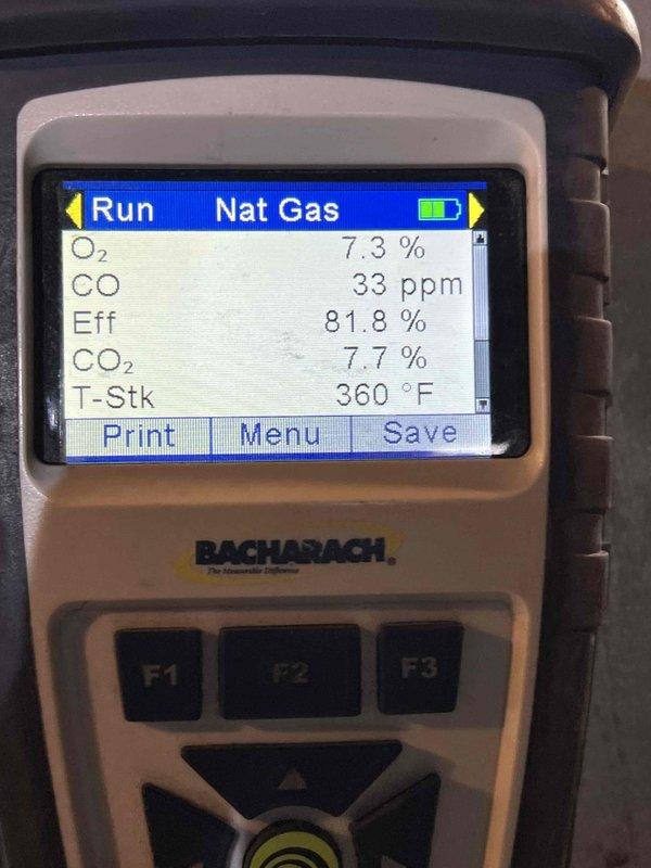 Performed comprehensive tune-up and city certification inspection on 24-year-old natural gas furnace located in basement. Conducted combustion analysis using digital analyzer, recording oxygen level at 7.3%, carbon monoxide at 33 ppm, efficiency at 81.8%, carbon dioxide at 7.7%, and stack temperature at 360°F. Verified proper operation of carbon monoxide alarm and inspected all gas connections, supply lines, and associated HVAC components for safety and compliance.