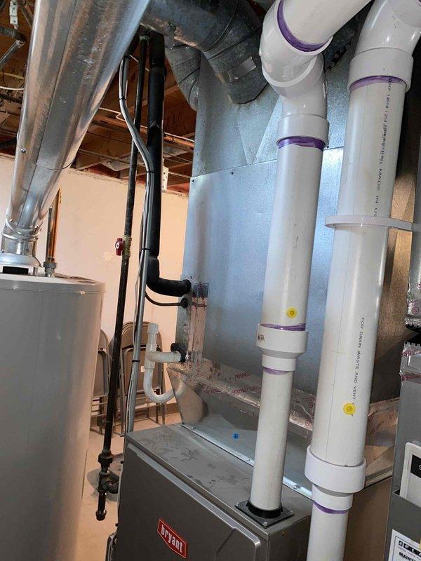 Completed estimate for replacement of 20+ year old Bryant air conditioning system and natural gas furnace located in basement mechanical room. Current equipment operational but aging beyond recommended service life. Assessed existing HVAC infrastructure including ductwork distribution system, PVC condensate drainage lines, and equipment accessibility for replacement installation planning.