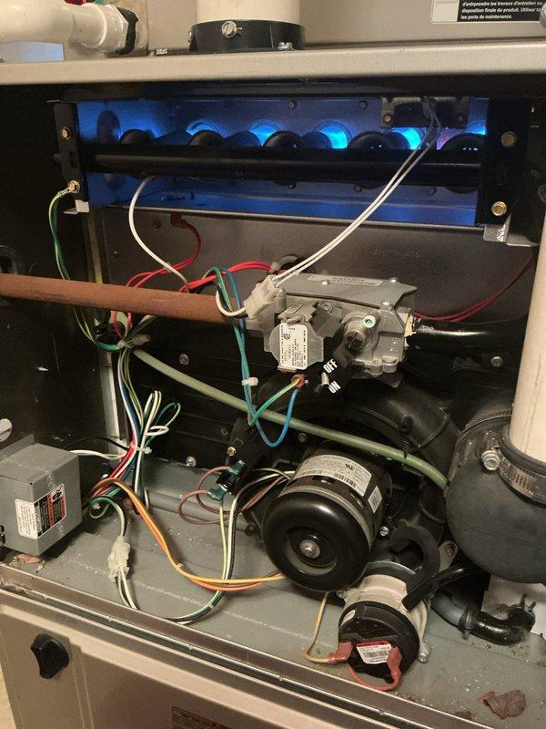 Completed comprehensive Gold AC and furnace inspection on 10+ year old HVAC system with equipment located in basement. Performed thorough examination of gas furnace including burner assembly, heat exchanger, gas valve, blower motor, electrical connections, and all safety controls, confirming proper operation with blue flame combustion. Inspected outdoor condensing unit including compressor, condenser coil, fan motor assembly, refrigerant lines, and electrical components, verifying adequate clearances and operational functionality. All systems operating within normal parameters at time of inspection.