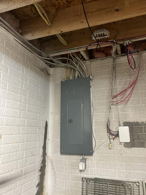 Conducted comprehensive on-site evaluation for residential backup generator installation. Assessed existing electrical infrastructure including main service panel location in basement utility area and available outdoor placement options adjacent to AC condenser unit. Documented current electrical system configuration, panel capacity, and optimal generator positioning near existing HVAC equipment on gravel pad area. Photographed electrical panel, conduit routing, and proposed exterior installation site to develop accurate material and labor specifications for automatic transfer switch integration and generator pad preparation.