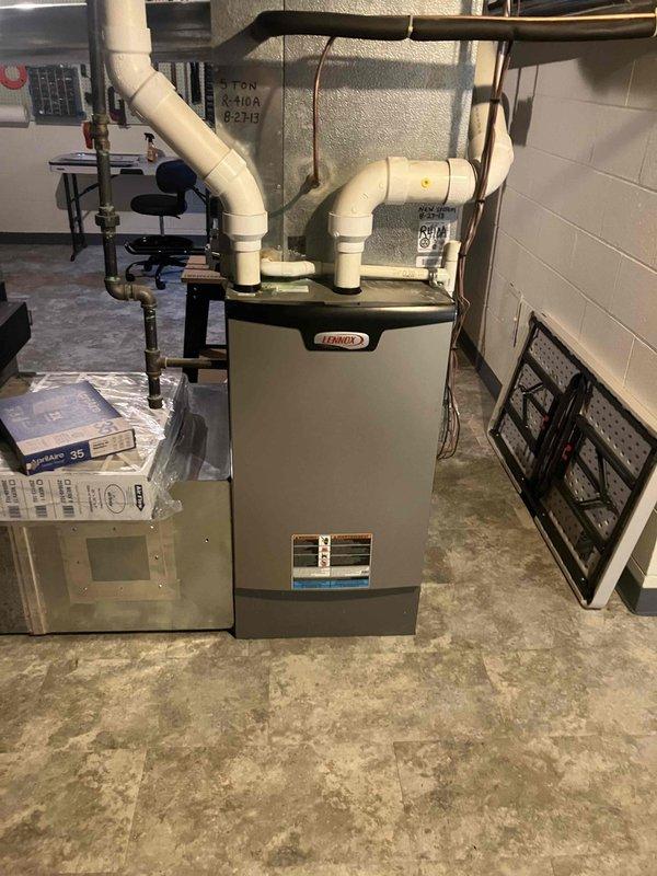 Completed comprehensive Gold-level furnace inspection on 9-year-old Lennox forced air system located in basement. Performed full system evaluation including visual inspection of heat exchanger, burner assembly, and all safety controls. Verified proper operation of blower motor, checked gas pressure and combustion efficiency, inspected venting system and PVC condensate drainage, and tested thermostat functionality. All components found operating within manufacturer specifications with no immediate service needs identified.