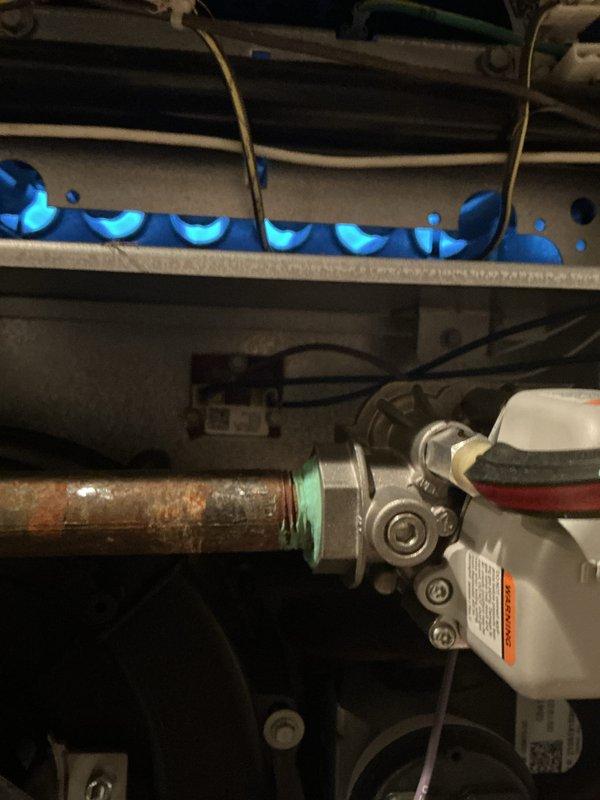 Completed routine furnace inspection and tune-up on a 4-year-old unit located in the basement. Performed standard maintenance procedures including filter replacement, visual inspection of all components, and documentation of existing copper pipe corrosion with oxidation present on water supply lines near the furnace assembly.