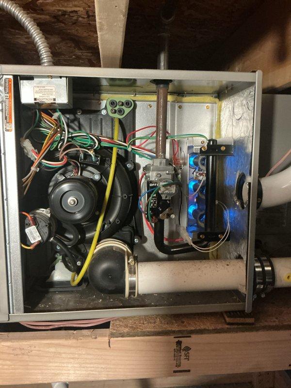 Completed comprehensive Gold Furnace Inspection on 13-year-old furnace system with units located in basement and conditioned crawl space. Performed thorough examination of both heating units, including visual inspection of heat exchangers, burner assemblies, gas valve manifolds with blue valve connections, blower motor assemblies, electrical components, control boards with operational LED indicators, and all associated wiring connections. Verified proper operation of all safety controls, checked electrical connections throughout both systems, and inspected refrigerant lines and ductwork connections. Documented equipment condition with photographic evidence showing internal components including manifold assemblies, blower motors, capacitors, control boards, and terminal blocks. All units found to be functioning within normal parameters with no immediate safety concerns identified. Systems operational and ready for heating season.