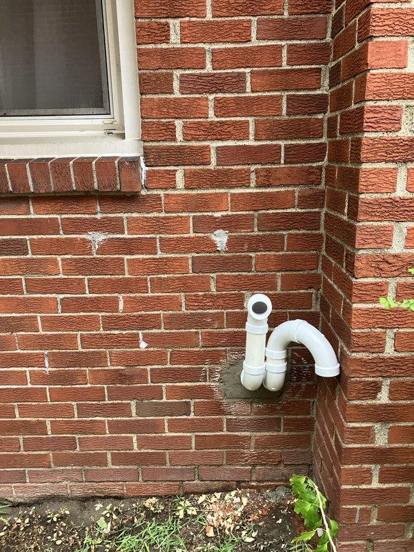 Completed full HVAC system replacement including installation of 70,000 BTU furnace and 2-ton air conditioning unit in rear yard location. Installed new Honeywell digital thermostat, humidifier, and condensate pump with proper PVC drainage piping routed along exterior brick wall. Reconnected all electrical and mechanical components, obtained mechanical and electrical permits, and verified system operation with thermostat displaying proper cooling function.