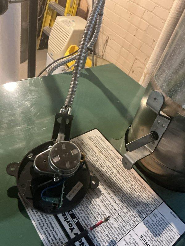 Responded to service call for animals entering basement through boiler chimney system. Inspected 30-year-old boiler and automatic flue damper (Model GVD-7, 24VAC) which was malfunctioning and remaining in open position when boiler was off, allowing wildlife entry. Removed and tested the electromechanical vent damper actuator, confirming failure to close properly. Replaced defective automatic flue shutoff assembly and verified proper operation through multiple heating cycles. Inspected chimney cap and flue penetration points for additional entry access. Sealed gaps and reinforced chimney cap installation to prevent future animal intrusion. System tested and confirmed damper now closes completely during boiler off-cycle, eliminating wildlife access route.
