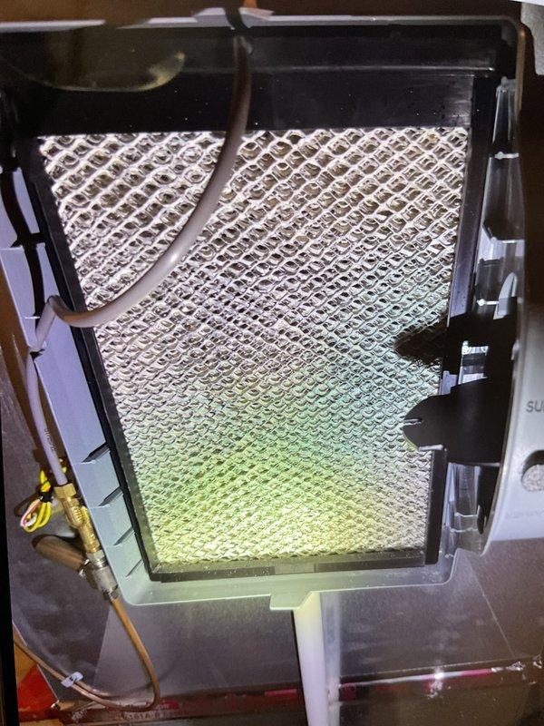 Completed comprehensive Gold furnace inspection on 3-year-old forced air heating system located in basement. Performed thorough visual examination of internal components including heat exchanger, burner assembly, and electrical connections. Inspected wiring harness and control board connections, verifying all wire terminations secure and properly bundled. Examined heat exchanger for signs of cracks or deterioration - found in good condition with no visible defects. Assessed air filtration system and documented filter condition showing moderate dust accumulation consistent with normal operation. Checked refrigerant line connections and service ports for proper installation. Verified all safety controls and electrical components functioning within manufacturer specifications. Unit operating properly with no immediate service needs identified. Documented equipment condition with photographic evidence for maintenance records.