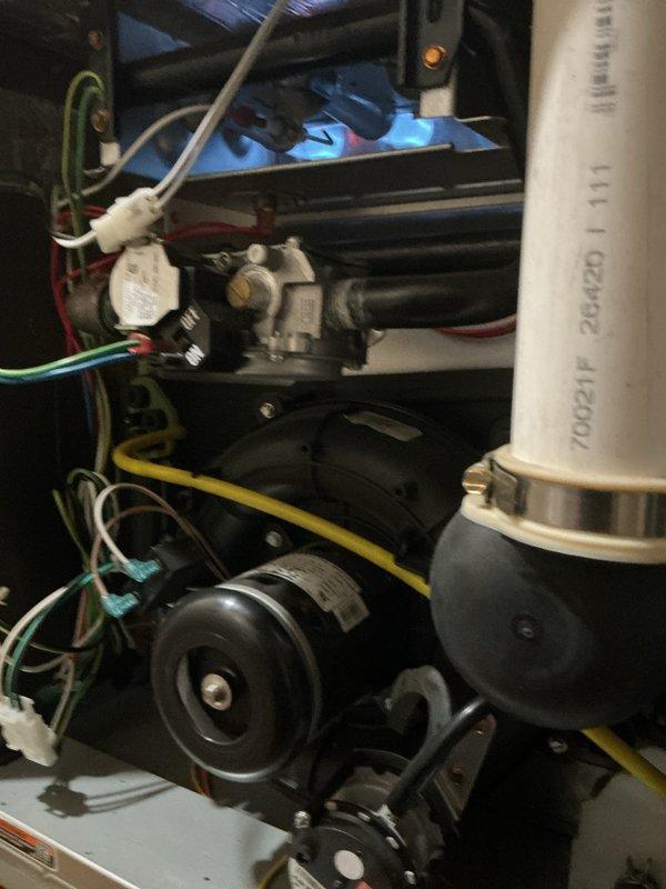 Completed comprehensive NSP furnace inspection on basement-located unit. Performed combustion analysis testing using calibrated digital analyzer, confirming carbon monoxide levels at safe operating parameters of 0.0% CO with ambient readings of 25 ppm. Inspected and documented all internal mechanical components including inducer motor assembly, gas valve connections, pressure switches, and condensate drainage system with PVC piping, verifying proper installation and secure mounting of all equipment.