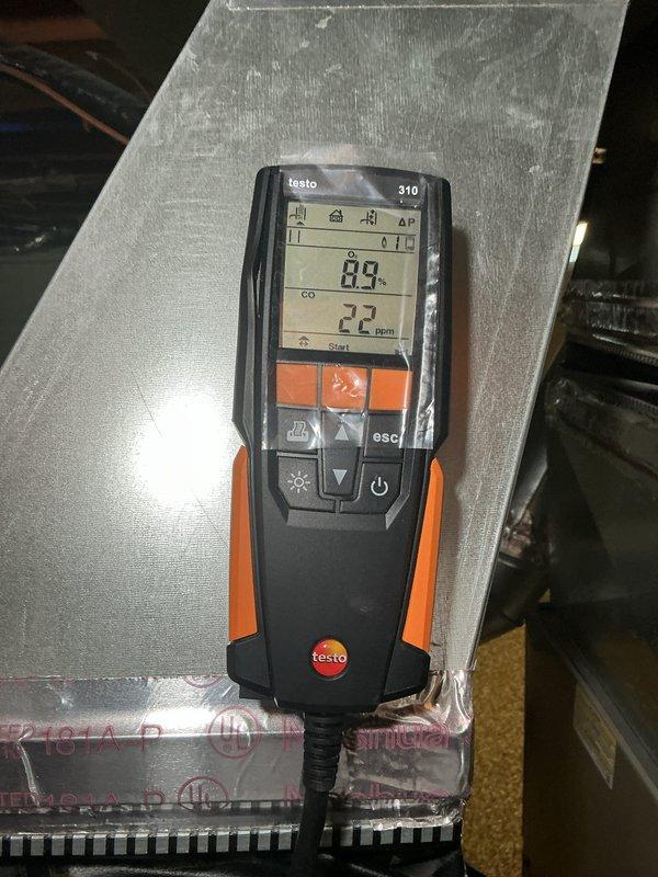 Completed comprehensive NSP furnace inspection on basement-located unit. Performed combustion analysis testing using calibrated digital analyzer, confirming carbon monoxide levels at safe operating parameters of 0.0% CO with ambient readings of 25 ppm. Inspected and documented all internal mechanical components including inducer motor assembly, gas valve connections, pressure switches, and condensate drainage system with PVC piping, verifying proper installation and secure mounting of all equipment.