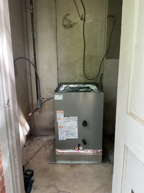 Completed full installation of 3.5-ton A/C system with evaporator coil and 2000 media cabinet in interior utility closet. Air handler unit positioned and secured on concrete floor with electrical conduit run and connected, condensate drain line installed, and all manufacturer specifications verified. System wired per code requirements with mechanical and electrical permits requested, unit tested for proper operation, and rear discharge configuration confirmed with all connections remeasured for accuracy.