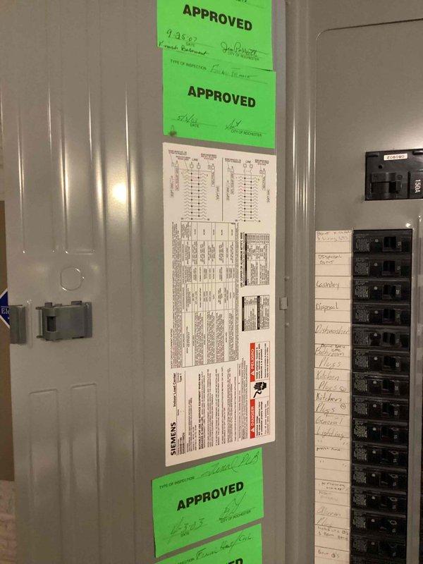 Conducted on-site electrical assessment for new whole home generator installation at manufactured home. Evaluated existing Siemens electrical service panel, documented current circuit breaker configuration and available capacity, and photographed panel specifications and approved inspection documentation to determine compatibility and requirements for generator integration with main electrical system.