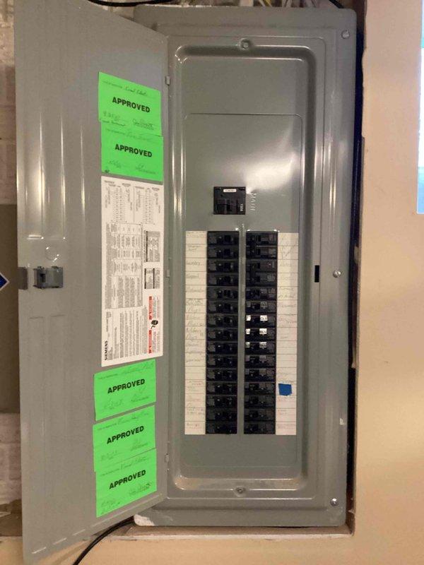 Conducted on-site electrical assessment for new whole home generator installation at manufactured home. Evaluated existing Siemens electrical service panel, documented current circuit breaker configuration and available capacity, and photographed panel specifications and approved inspection documentation to determine compatibility and requirements for generator integration with main electrical system.