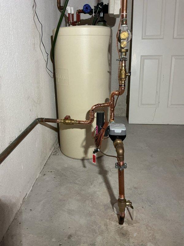 Coordinated with Independence Township for city water shut-off and restoration. Replaced second-floor toilet with ADA-compliant elongated white toilet, including new stop valve, supply line, and escutcheon for 1/2" copper straight connection. Removed and replaced drop-in utility sink with new unit, installed new stop valves and customer-supplied faucet, connected to existing drain line, and tested for proper operation. Rebuilt water meter assembly with new #1 and #2 meter valves, replaced SharkBite irrigation valve, and tied into existing riser. Installed expansion tank at water heater with copper piping connections and proper mounting. Inspected and addressed leaking kitchen faucet. All fixtures tested and verified operational upon completion.